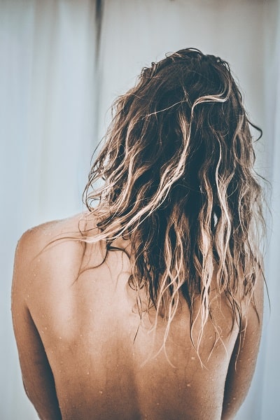 How Long Does It Take To Train Your Hair To Be Washed Less?